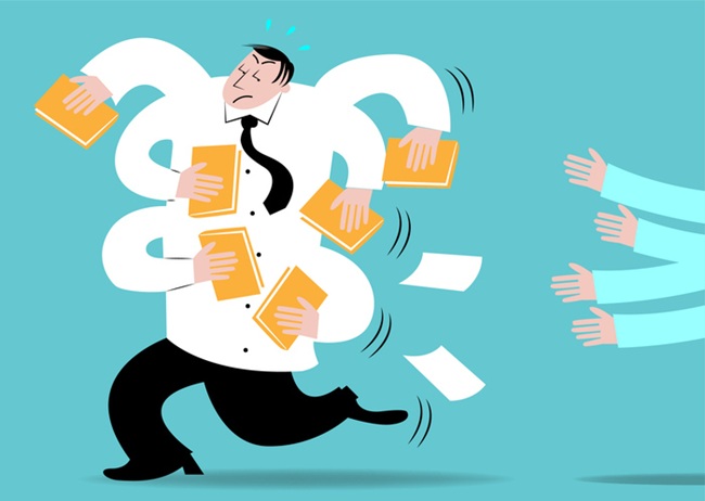 Stressed worker juggling documents, representing the need for outsourcing legal eFiling.